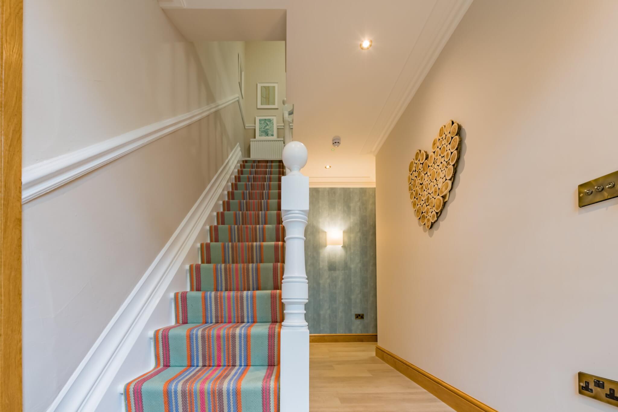 Hallway with stairs and log heart