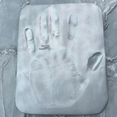 Hand print in clay